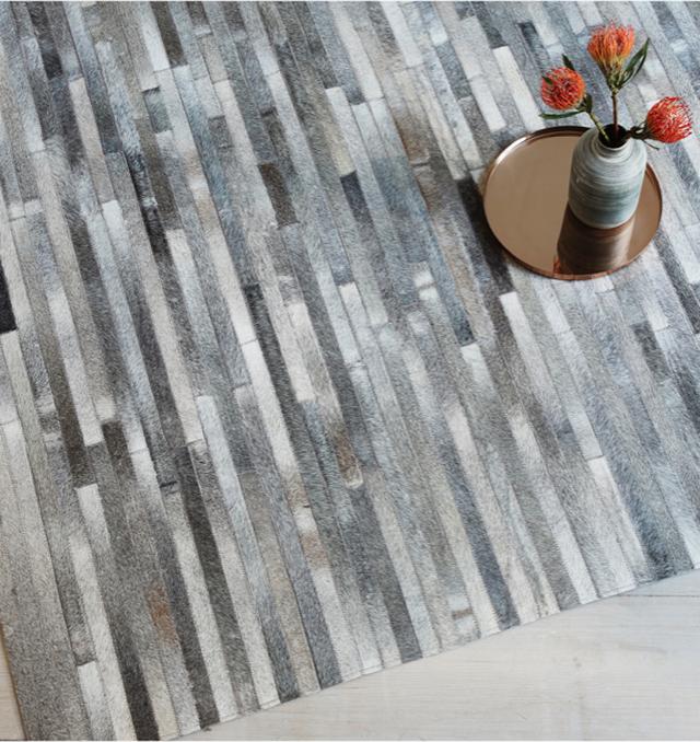 White bedroom ideas – leather cowhide rug